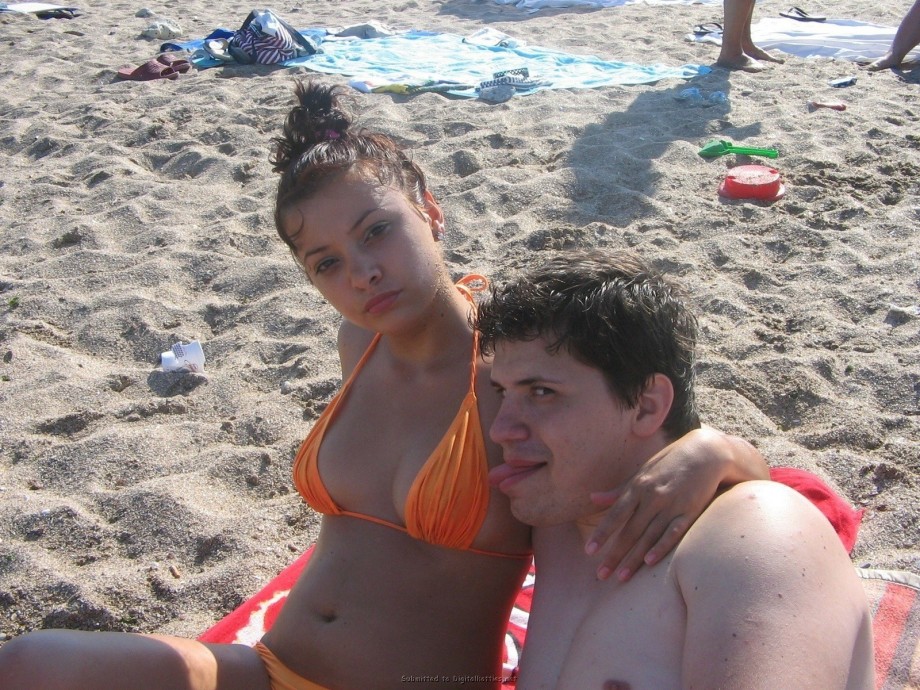 Young teen couple on the beach 