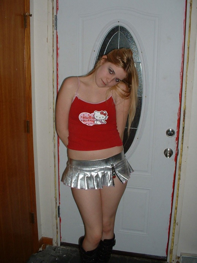 Slightly chubby blond teen girlfriend posing