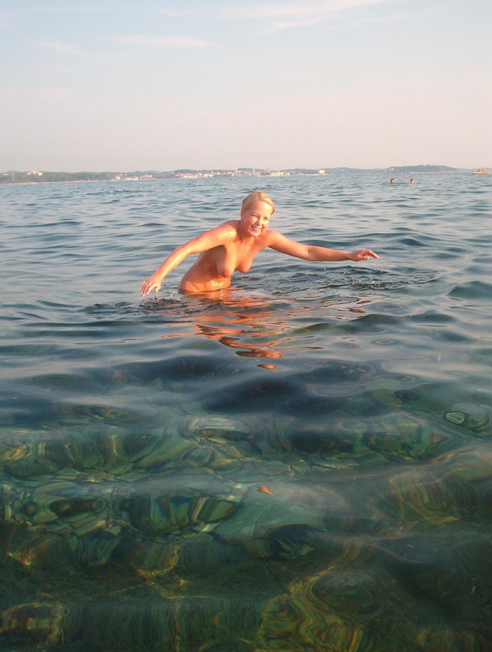 Blond girl at nudist beach