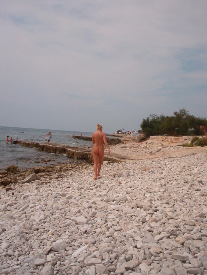 Blond girl at nudist beach