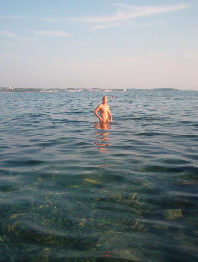 Blond girl at nudist beach