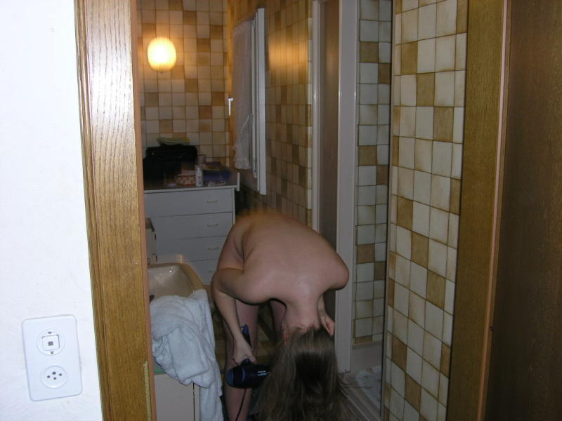 Young blond girl in bathroom