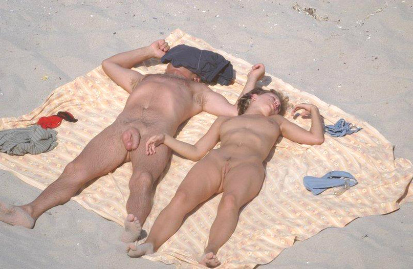 Young nudist couple at beach no.01