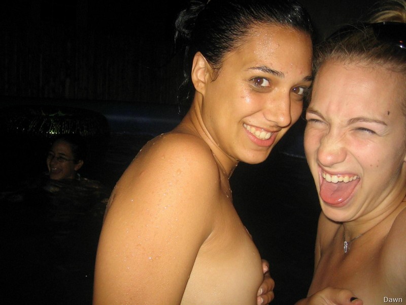 Three naked girls making fun in pool