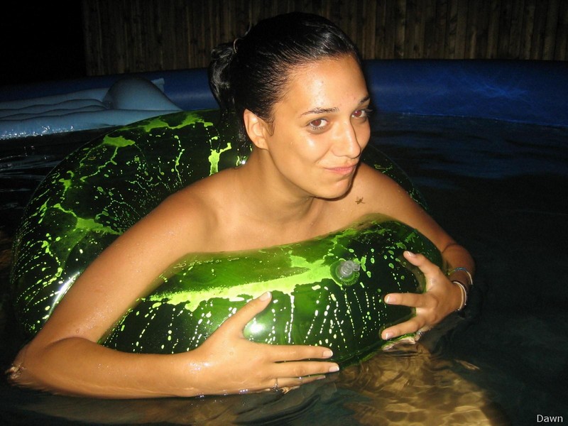 Three naked girls making fun in pool