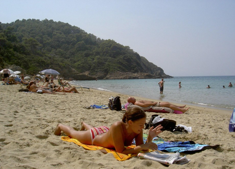 Teen blond girl on holiday  at the beach