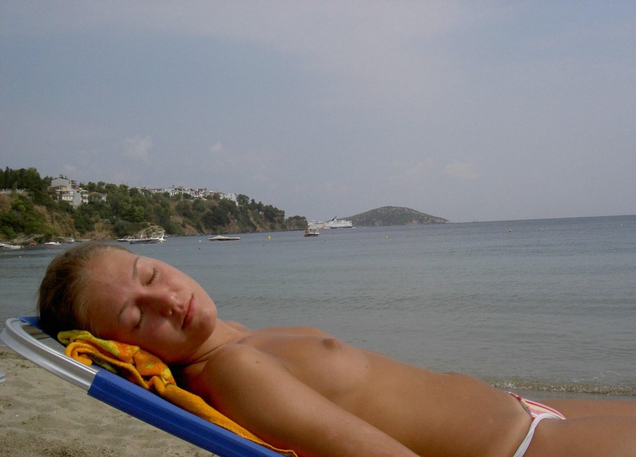Teen blond girl on holiday  at the beach