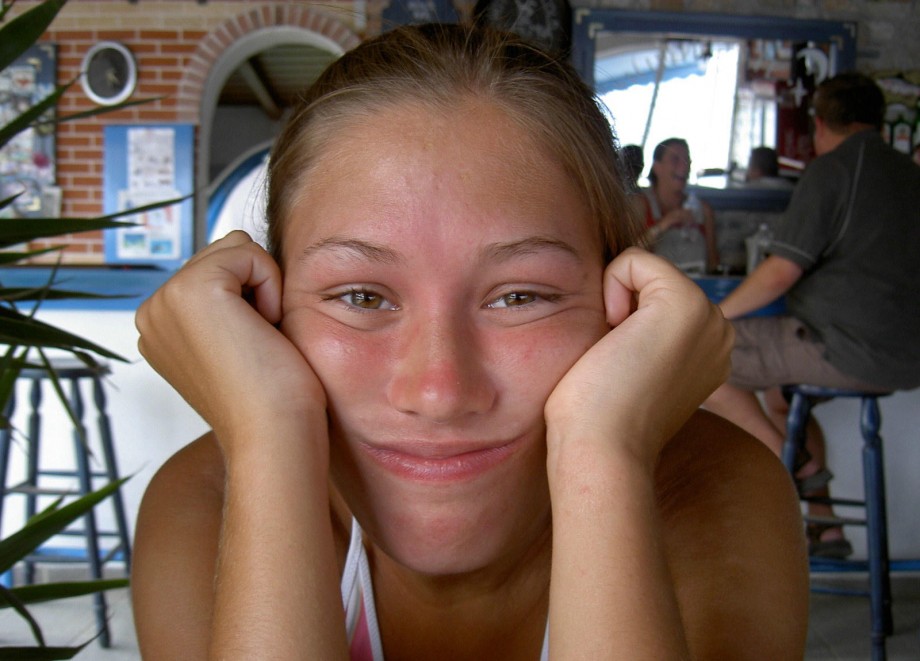 Teen blond girl on holiday  at the beach