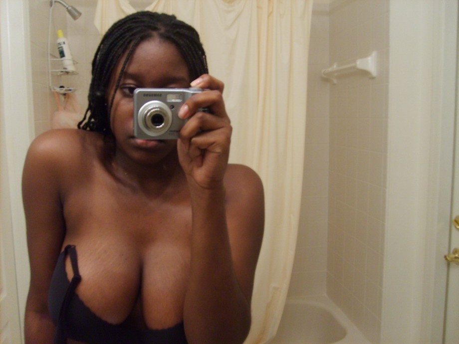 Black amateur girl and her big  tits on selfpics