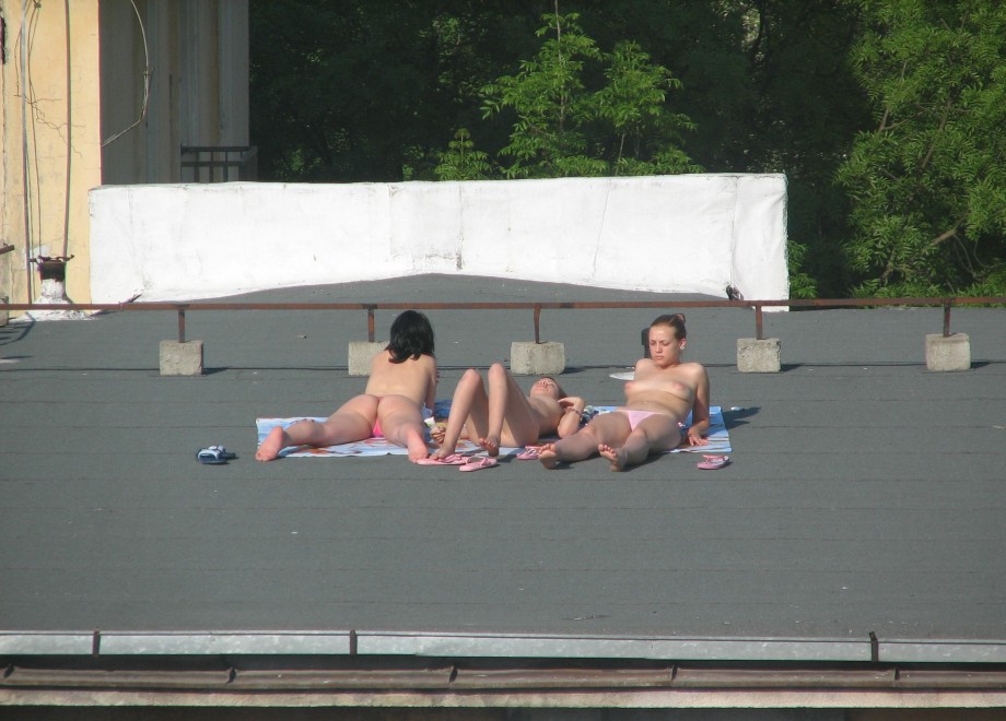 Teens sunbathing in the roof ( voyeur )