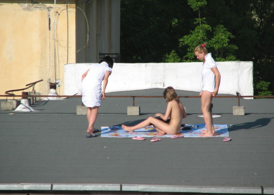 Teens sunbathing in the roof ( voyeur )