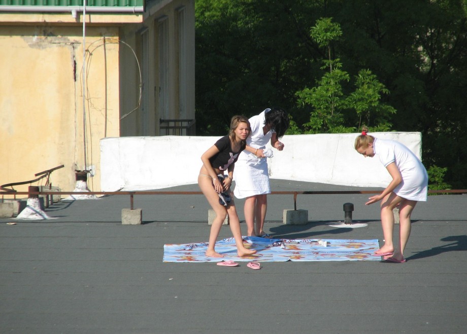 Teens sunbathing in the roof ( voyeur )