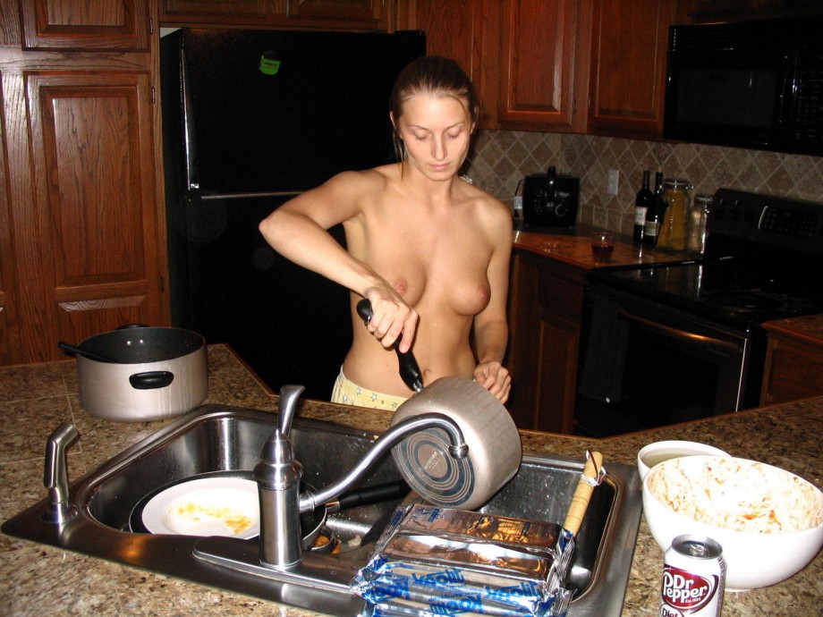 Naked amateur girls cook in the kitchen