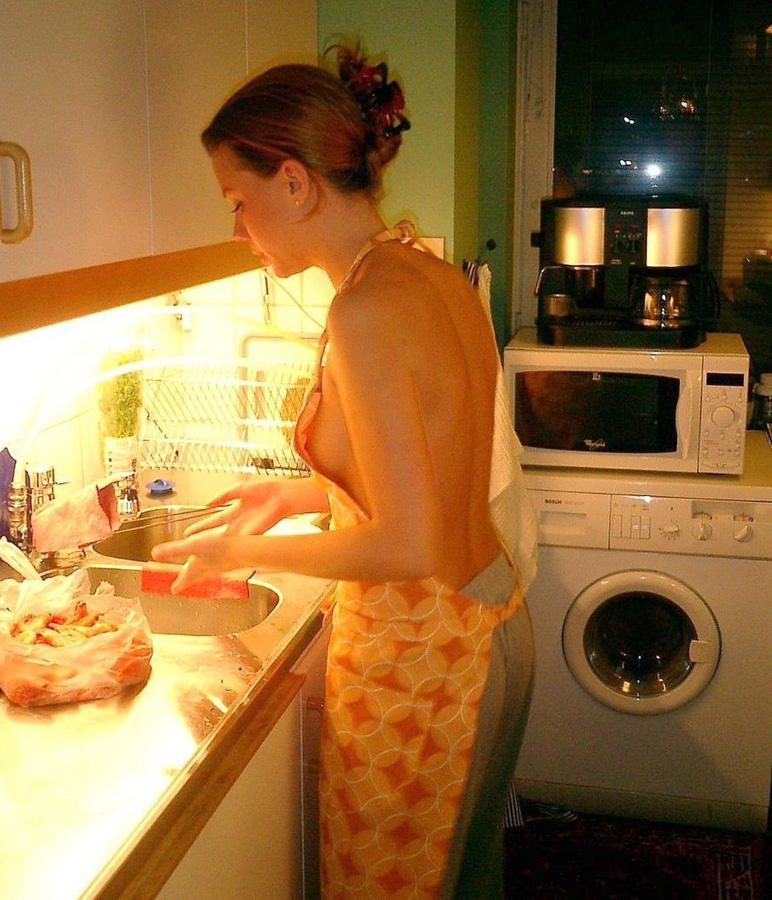 Naked amateur girls cook in the kitchen
