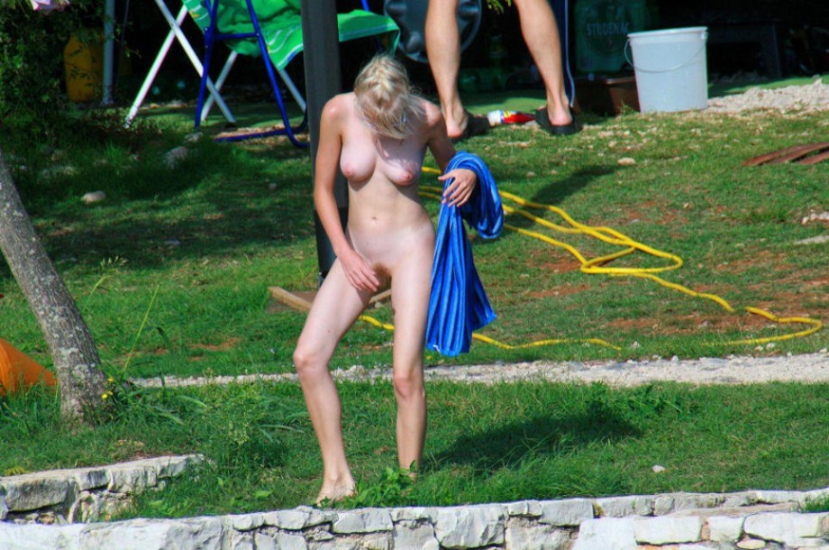 Young nudists and theirs hot summer at the water