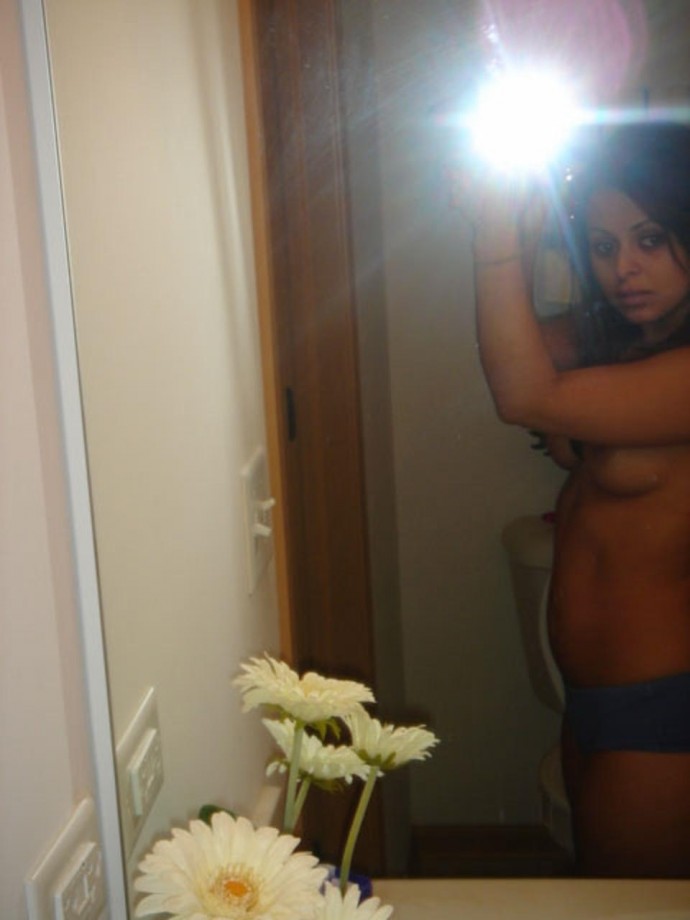 Brunette coed and her strip show in bathroom 