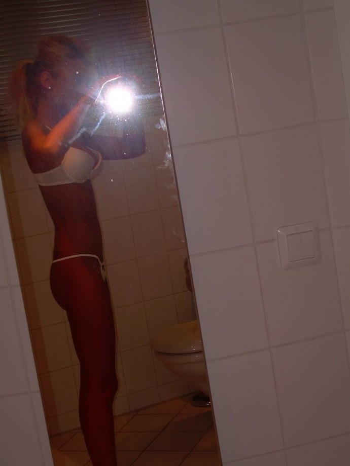 Hot blonde self-shots her small pussy
