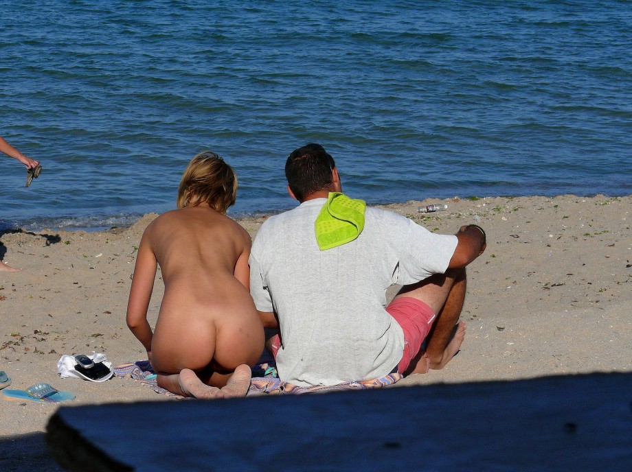 Nudist couple on the beach 