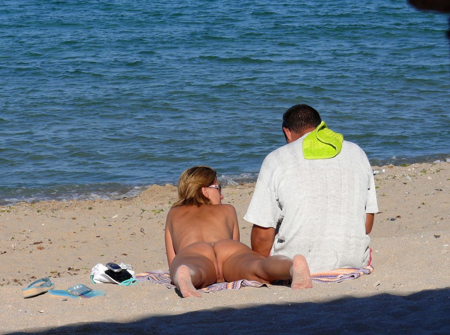 Nudist couple on the beach 