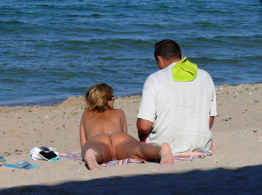 Nudist couple on the beach 