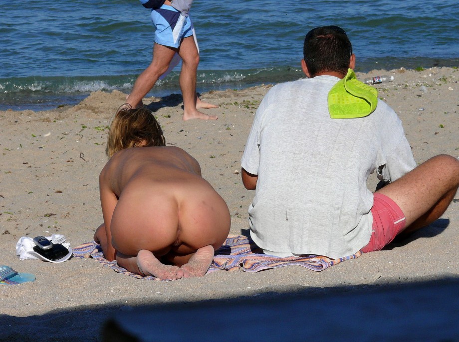 Nudist couple on the beach 