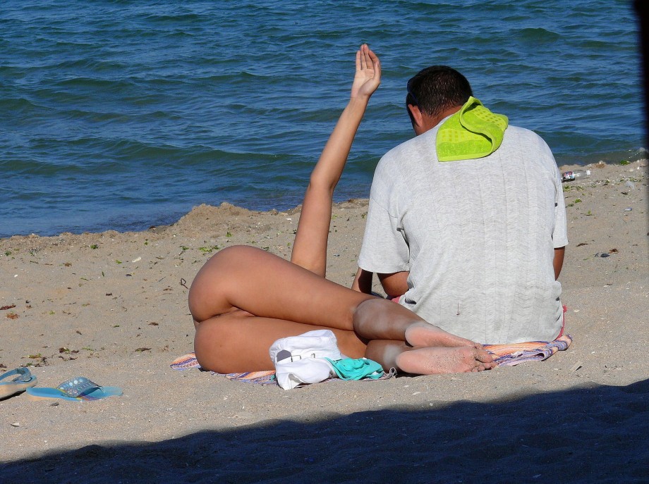 Nudist couple on the beach 