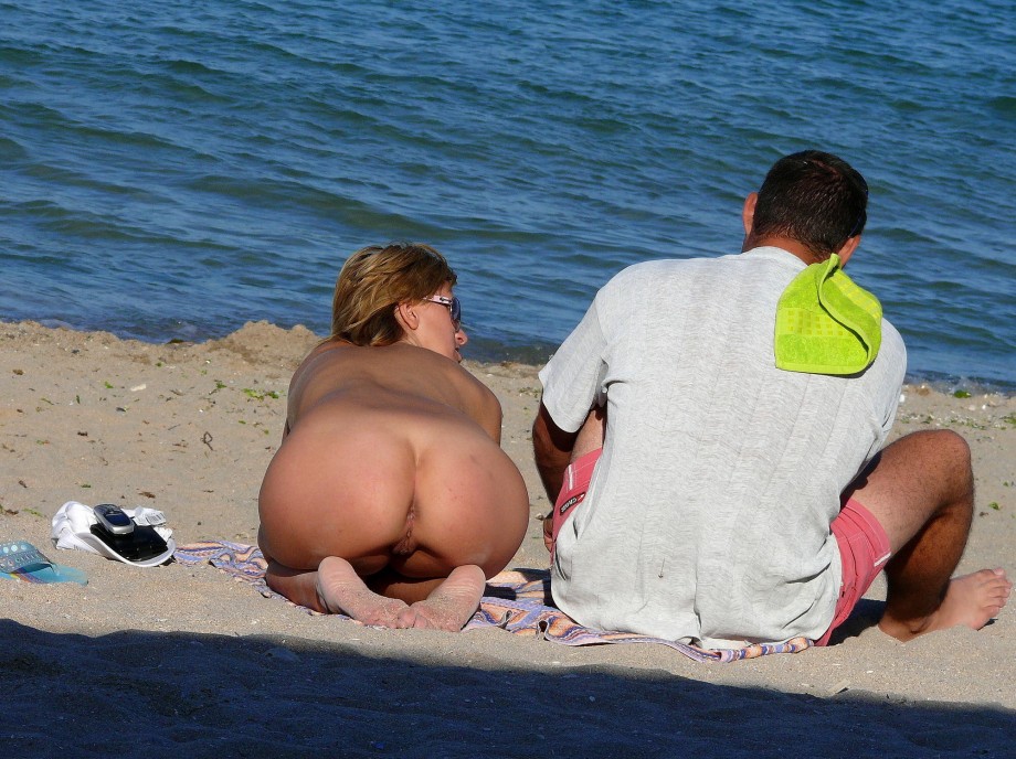 Nudist couple on the beach 