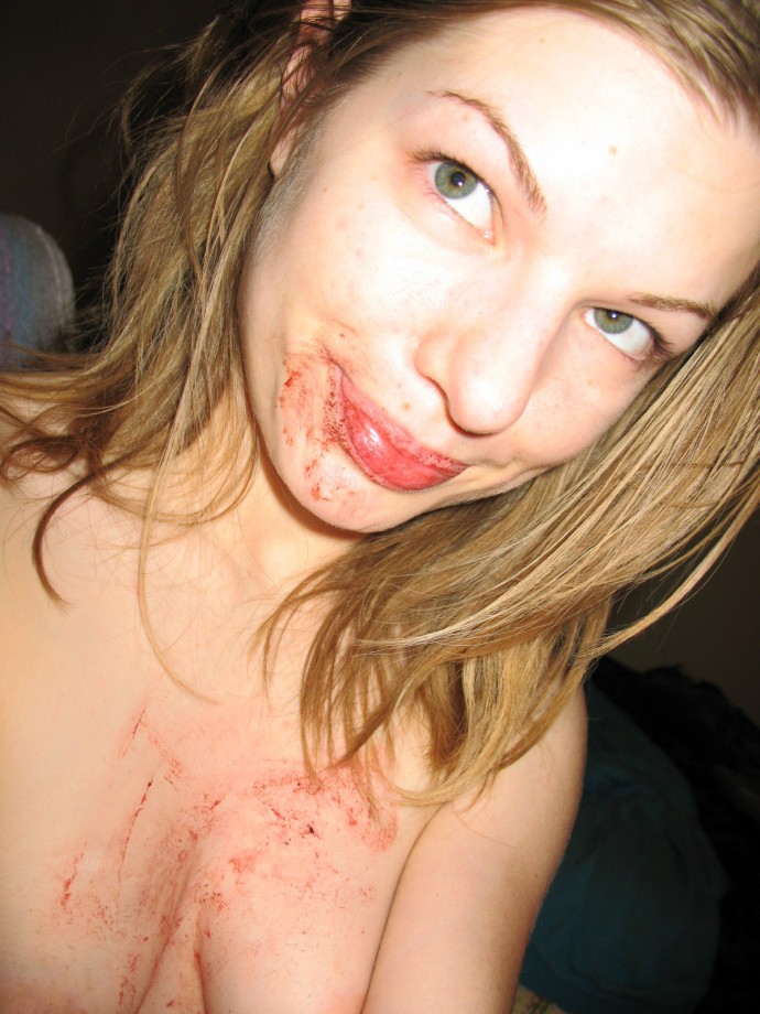 Amateur teen fingering her bloody pussy