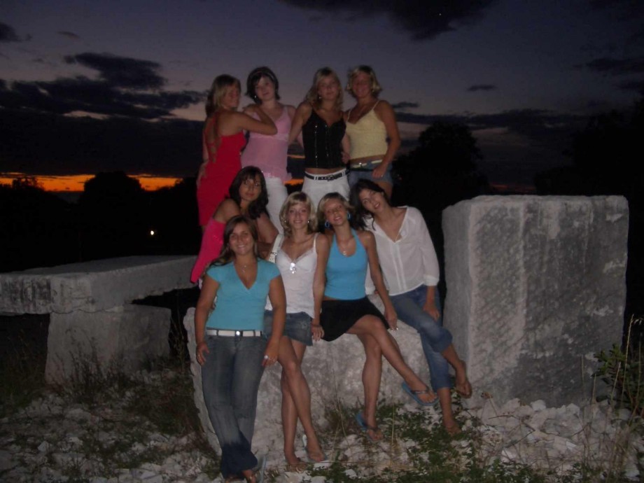 7 girls topless group shot on the beach 