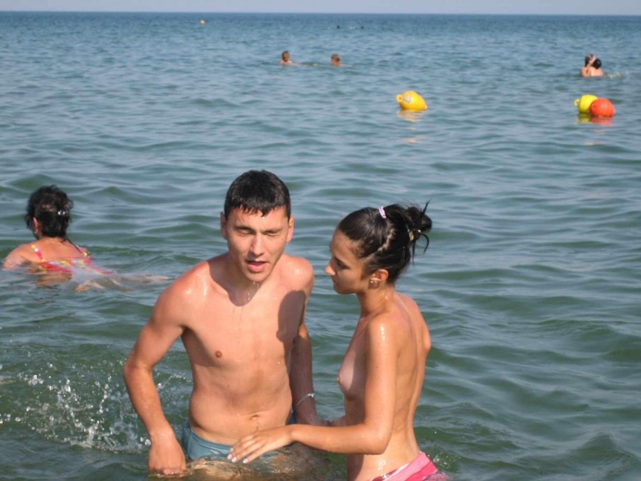 Young couples at holiday ( topless pics )