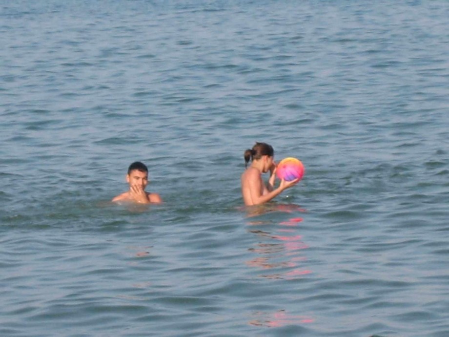 Young couples at holiday ( topless pics )