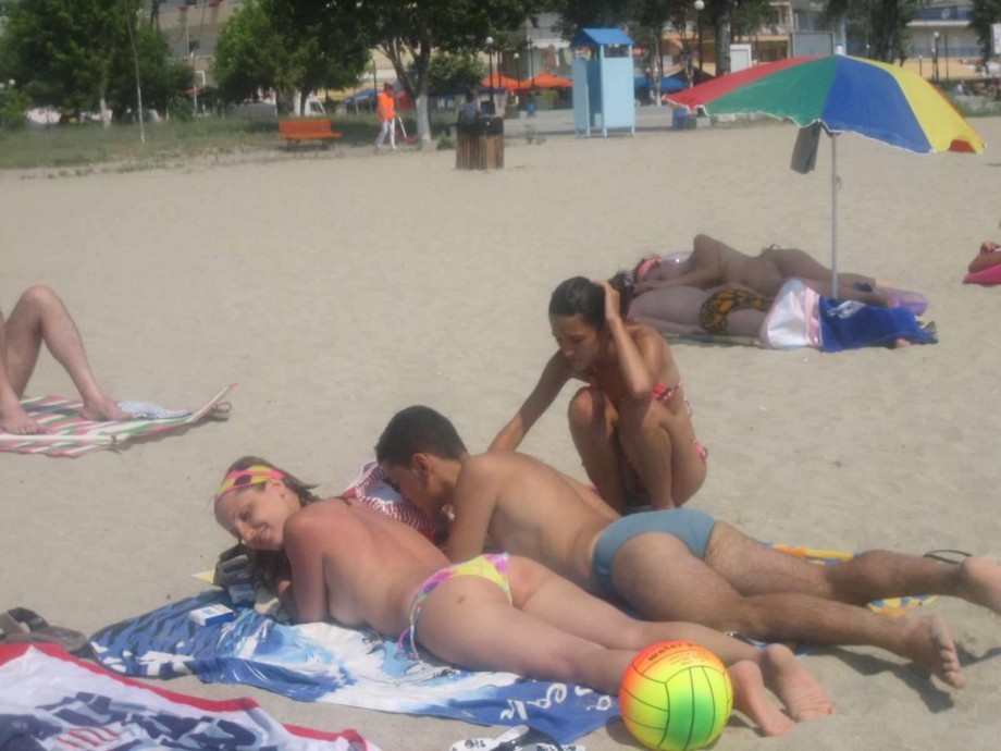 Young couples at holiday ( topless pics )