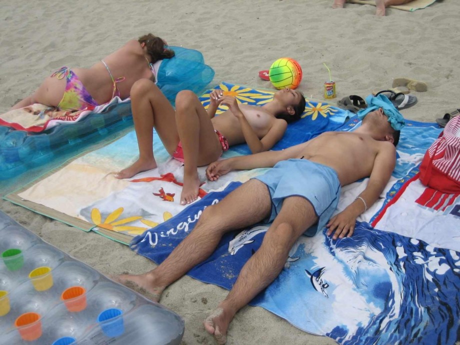 Young couples at holiday ( topless pics )