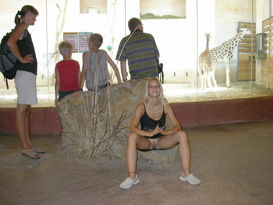 Young blonde girl and her exhibition  from the zoo