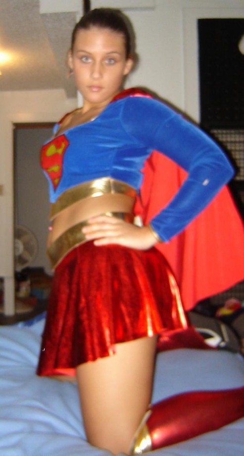 Dresses up in a supergirl outfit and masturbation