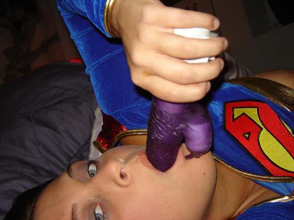 Dresses up in a supergirl outfit and masturbation