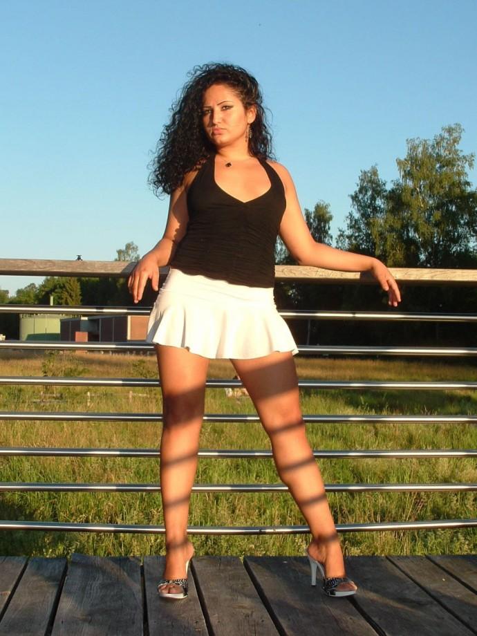 Latina posing outdoors