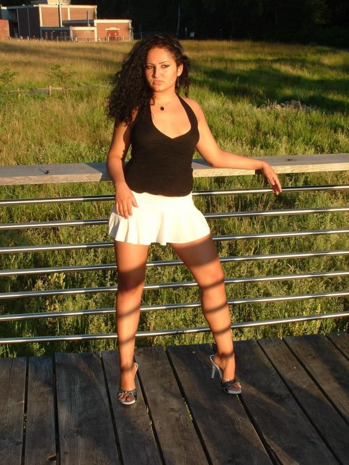 Latina posing outdoors