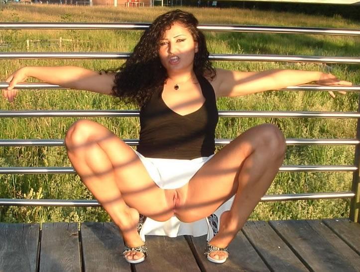 Latina posing outdoors