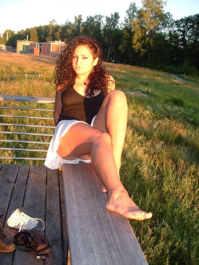 Latina posing outdoors