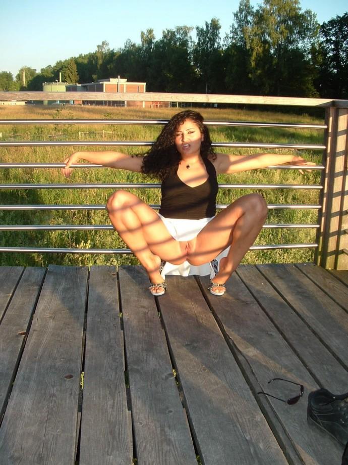 Latina posing outdoors