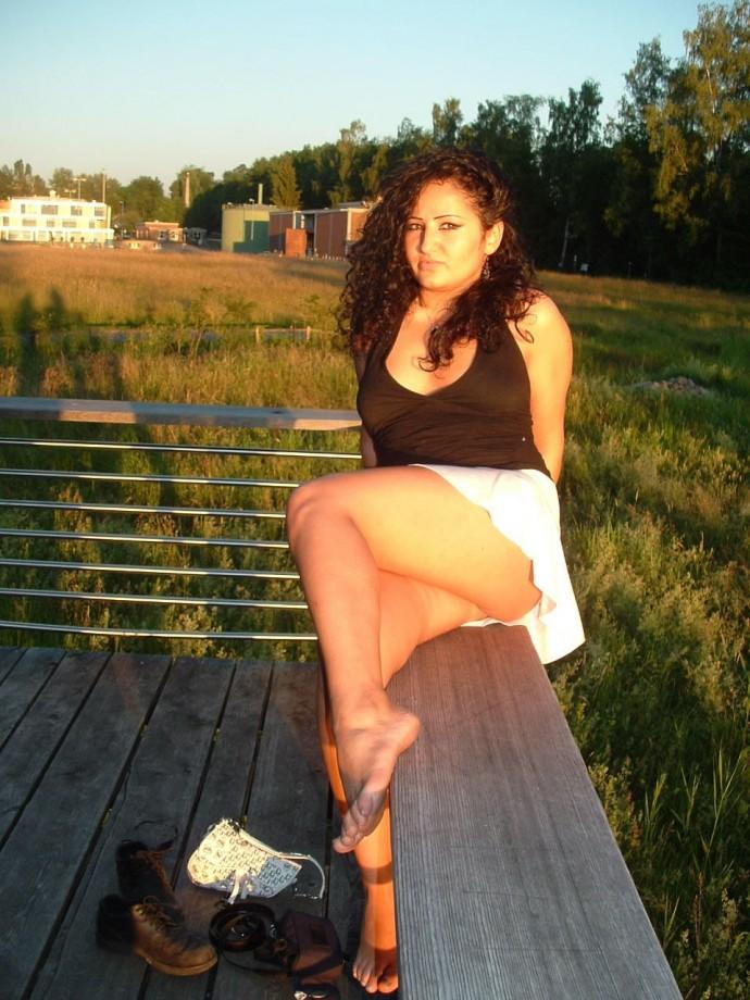 Latina posing outdoors