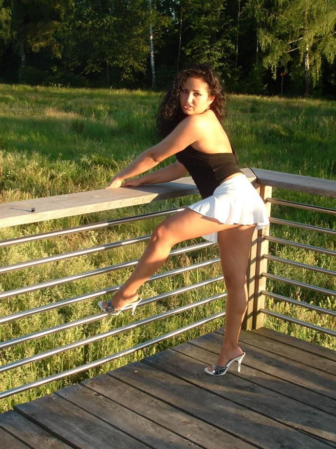 Latina posing outdoors