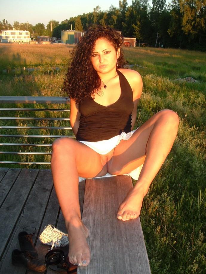 Latina posing outdoors