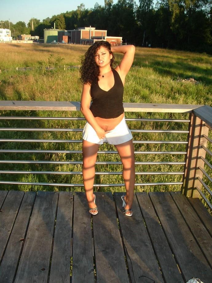 Latina posing outdoors