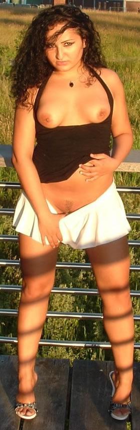 Latina posing outdoors