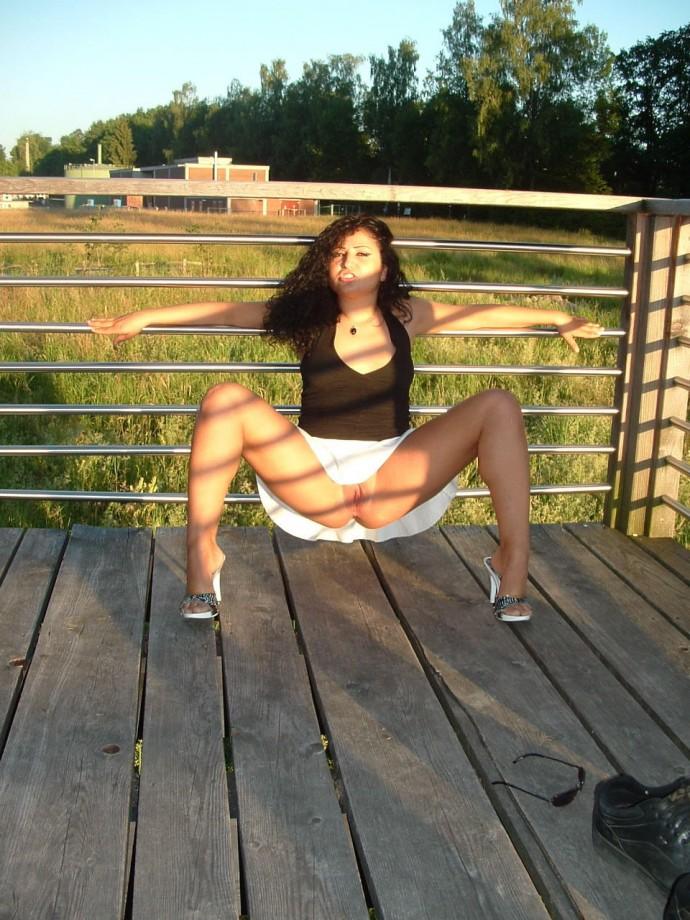 Latina posing outdoors