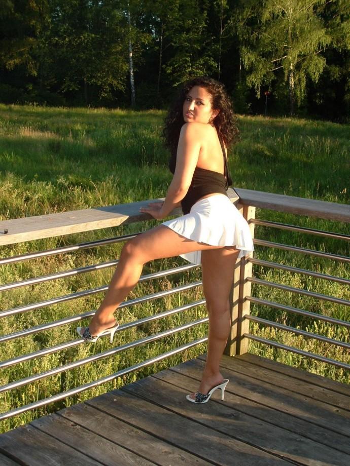 Latina posing outdoors