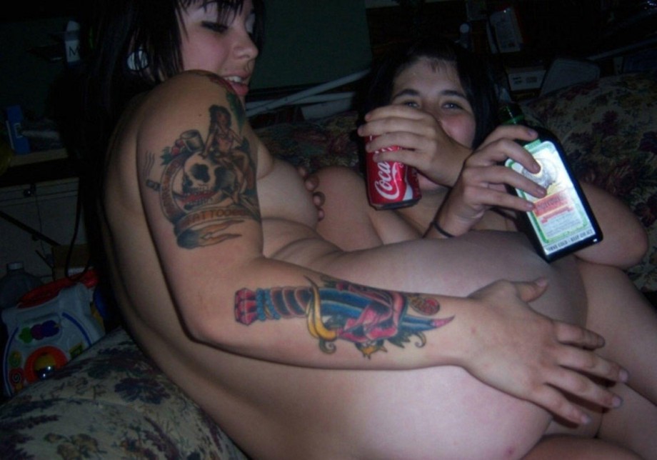 Tattooed girls get naked at a party 