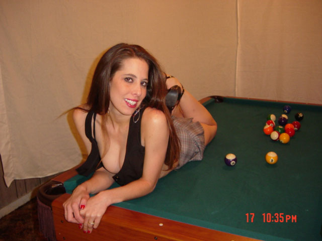 Brunette on a pool table